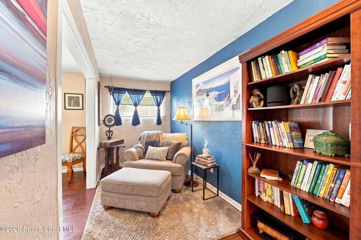 *Virtually staged flex room shown as a reading nook*