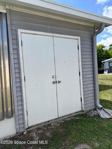 Double door to Utility Shed/Laundry Room
