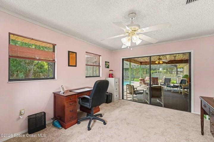Off of Primary Bedroom with closet and sliders to Pool.