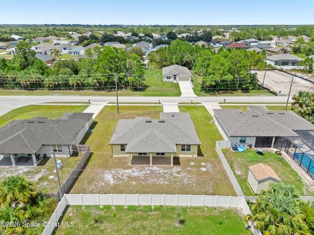 Elevated front view capturing the property and peaceful neighborhood setting