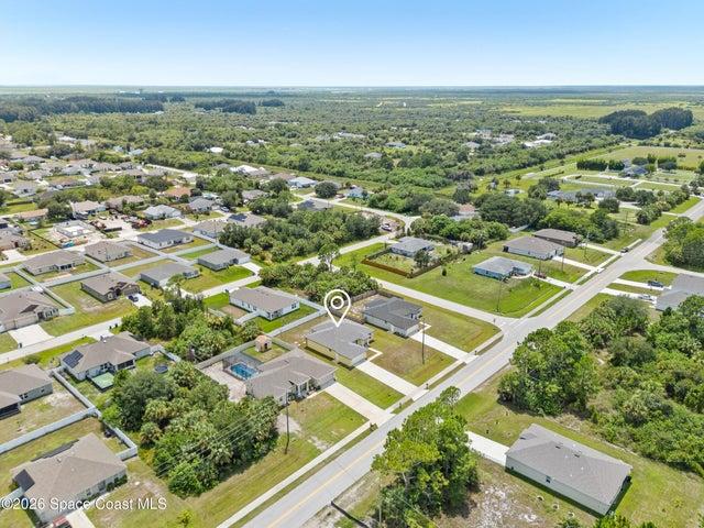 Aerial perspective showcasing the home’s impressive lot and surroundings.