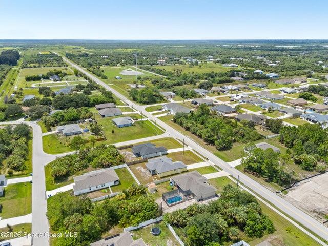 Aerial perspective showcasing the home’s impressive lot and surroundings