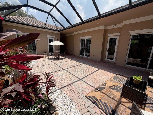 Courtyard view with sliders off living room and bedroom 2