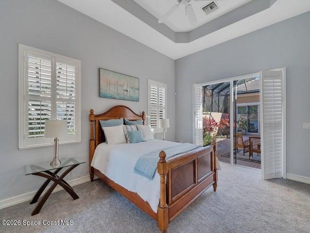 VStaged Primary bedroom view to courtyard