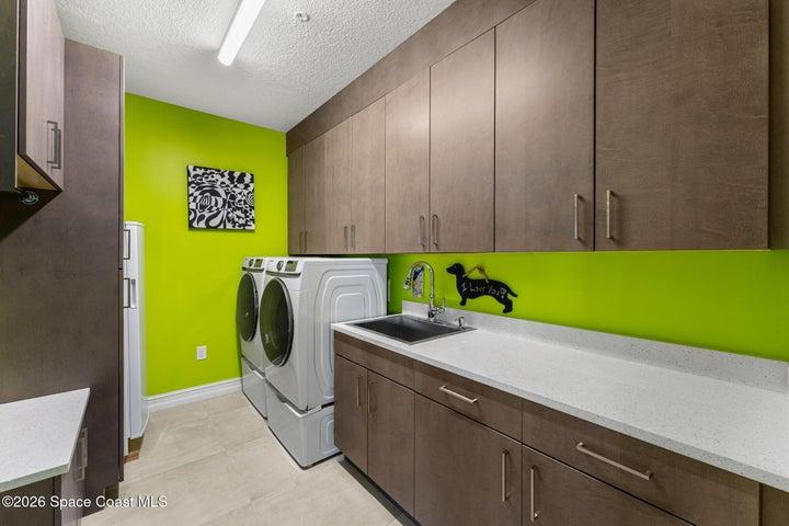 HUGE laundry room with quality cabinets