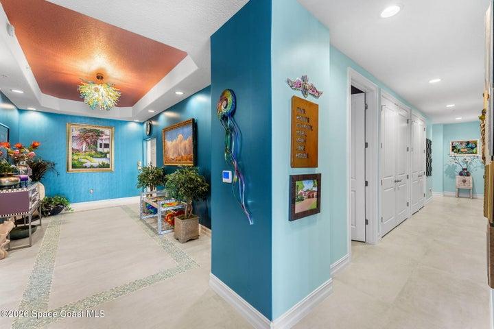 Hallway to powder room and 2 full suites