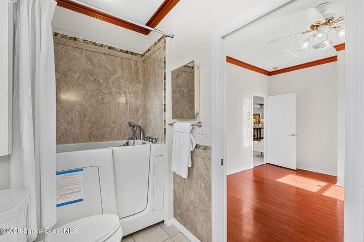 Bath 2 ensuite to bedroom 2 with walk-in tub