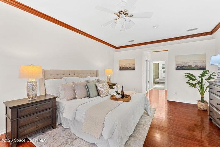 Huge primary bedroom with 2 closets and door to the sunroom