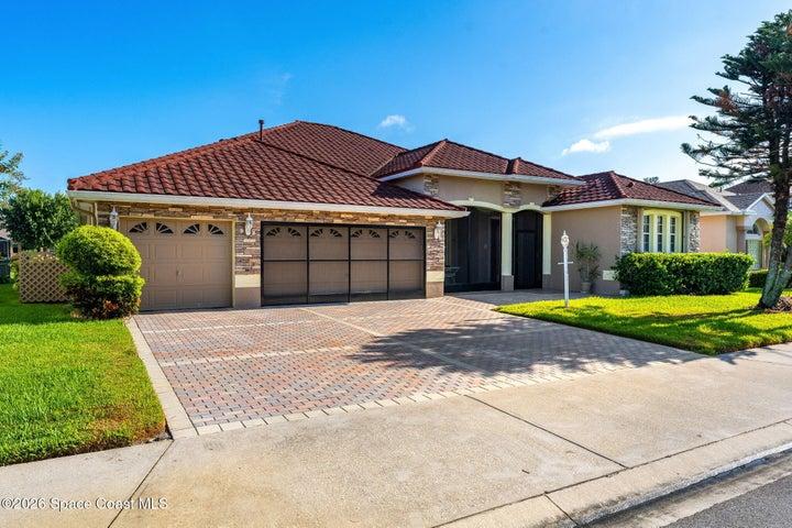 3-car garage and paver driveway offers ample parking