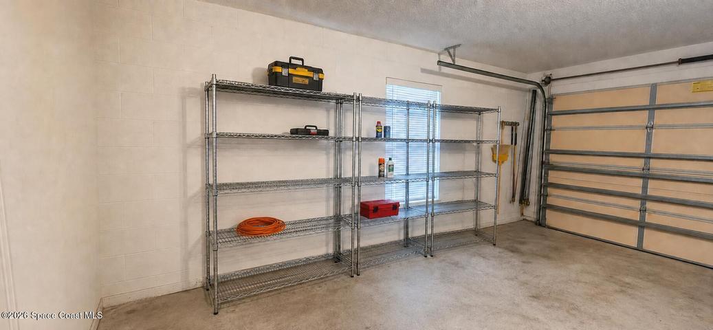 2 car garage with storage. Digitally decluttered.