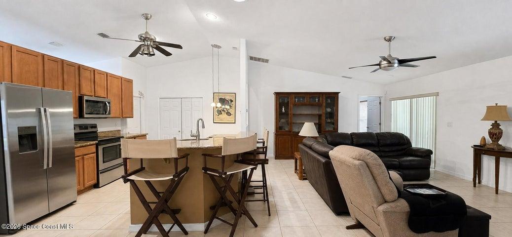 Kitchen, open living, breakfast nook. Digitally decluttered.