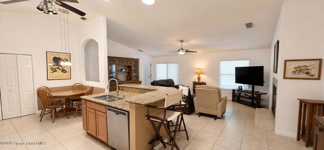 Kitchen with granite countertops. Digitally decluttered.