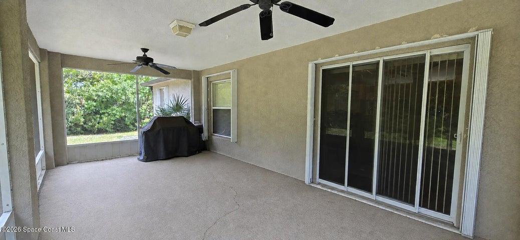 Screened in back patio. Digitally decluttered.