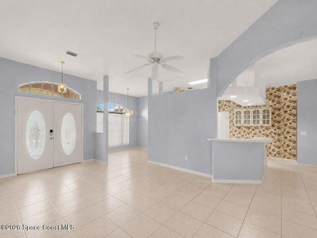 Front Entrance with Kitchen on the right and Dining room in the rear.
