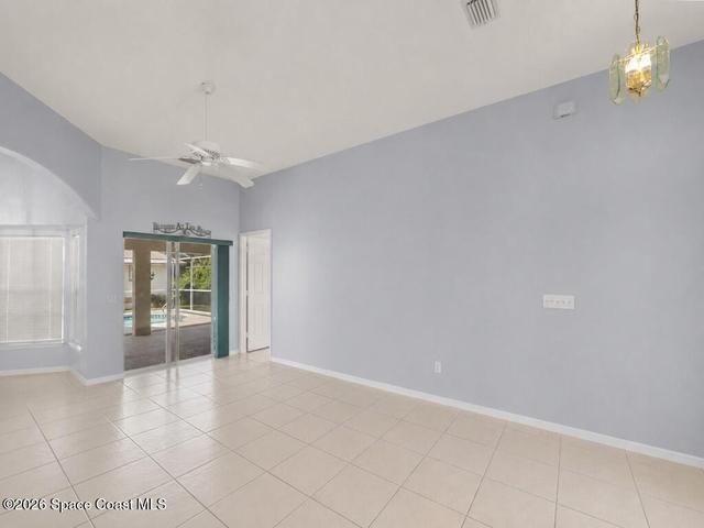 Vaulted Living room with sliding door exit to Pool area