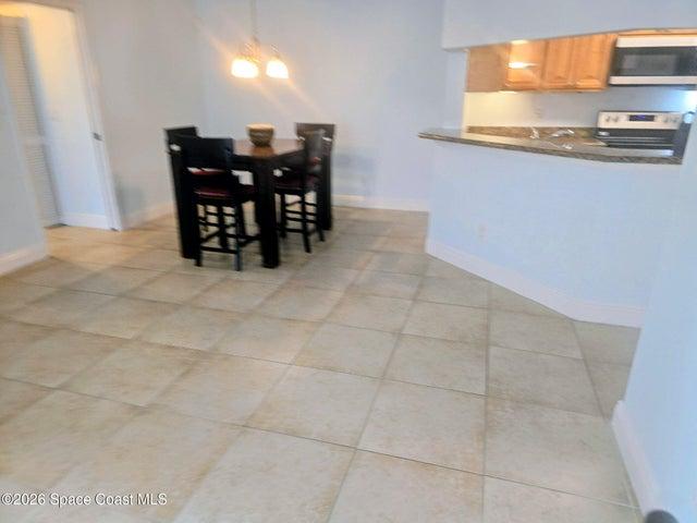 Tiled living room / dining room / freshly painted