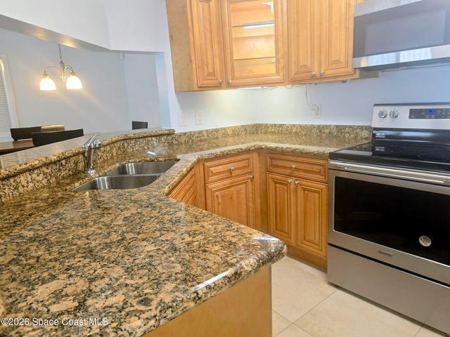 Kitchen with Granite countertops and newer appliances, including a Bosch dishwasher