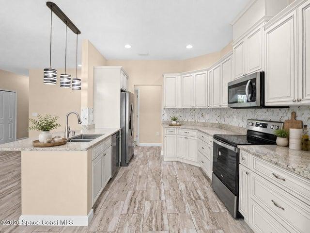 Bright kitchen with easy access to dining and living areas