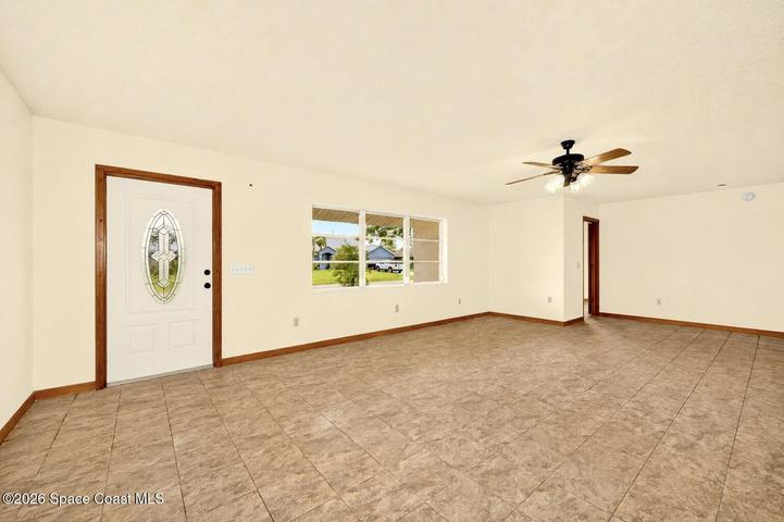 LARGE LIVING AREA, opens to dining and kitchen areas.