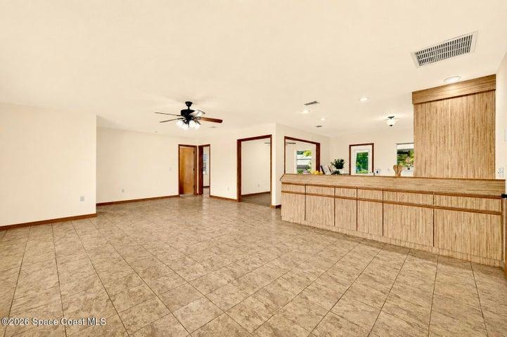 LARGE LIVING AREA, opens to dining and kitchen areas.