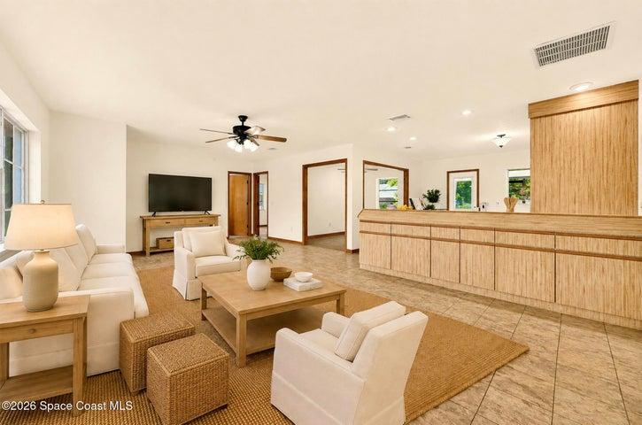 VIRTUALLY STAGED - LARGE LIVING AREA, opens to dining and kitchen areas.