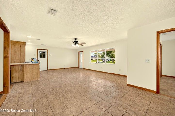 LARGE LIVING AREA, opens to dining and kitchen areas.