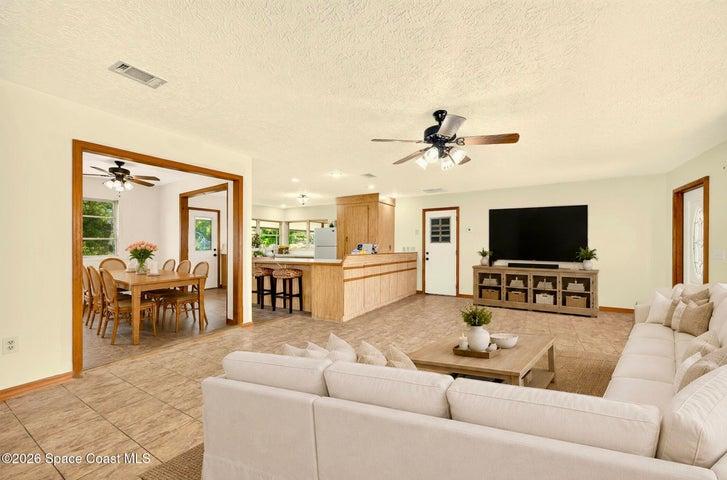 VIRTUALLY STAGED - LARGE LIVING AREA, opens to dining and kitchen areas.