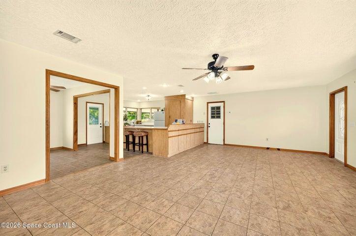 LARGE LIVING AREA, opens to dining and kitchen areas.