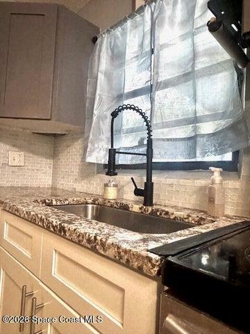 stone countertops and new kitchen faucet