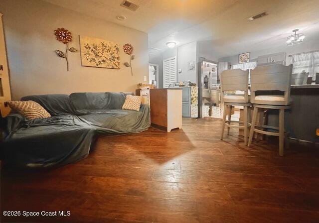 living room looking into dining/kitchen area