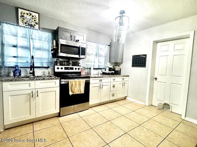 kitchen with large windows over looking back yard