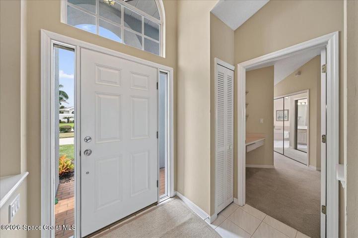 Front door with view of entrance to the primary suite