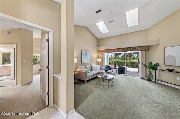 View of Primary Suite to the left and formal living room