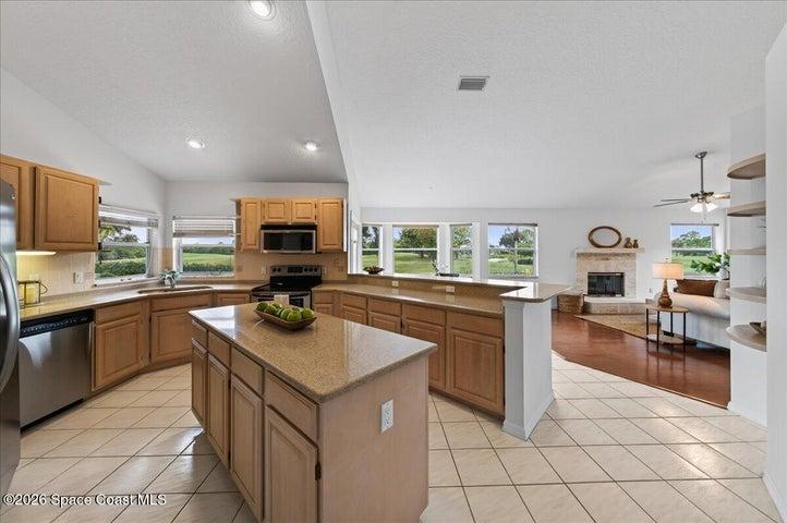 Large kitchen with an island, natural gas range, views of the golf course from the kitchen windows