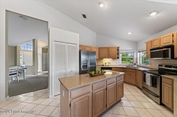 Large kitchen with an island, natural gas range, views of the golf course from the kitchen windows
