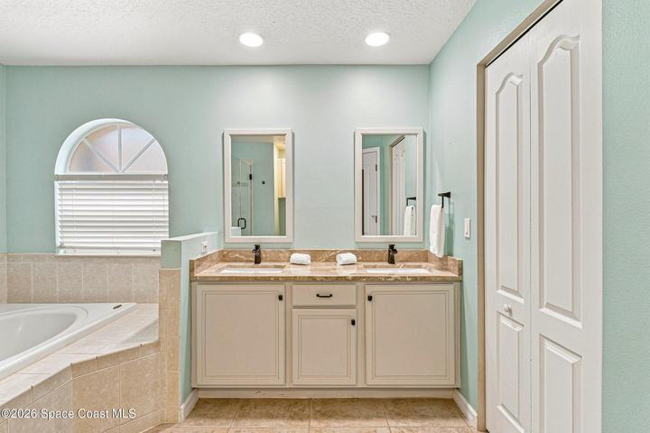 Double vanity in primary bath , huge walk in closet