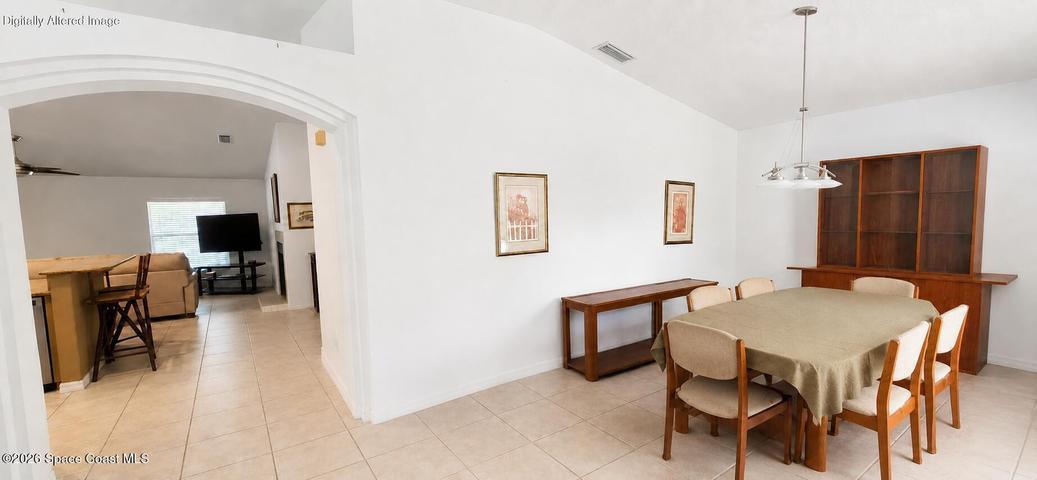 Entry with dining area. Digitally decluttered.