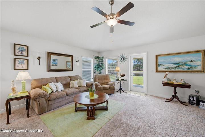 Tall ceiling, ceiling fan, access door to large covered porch... Lakefront views!