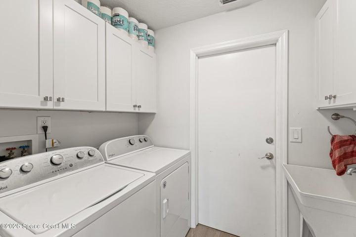 Laundry with Ample Storage & Garage Access