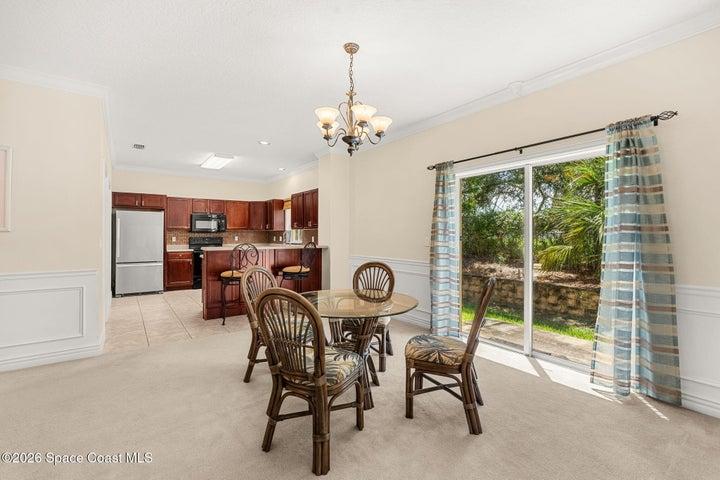 Dedicated dining space with a view of the trees out back.
