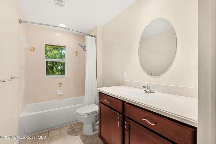 Secondary bathroom with tub upstairs.