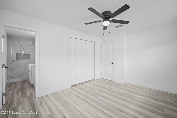 Primary bedroom with walk-in closet