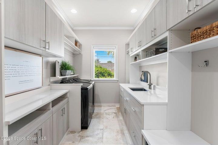 With Built -In Ironing Board, Utility Sink and Washer and Dryer