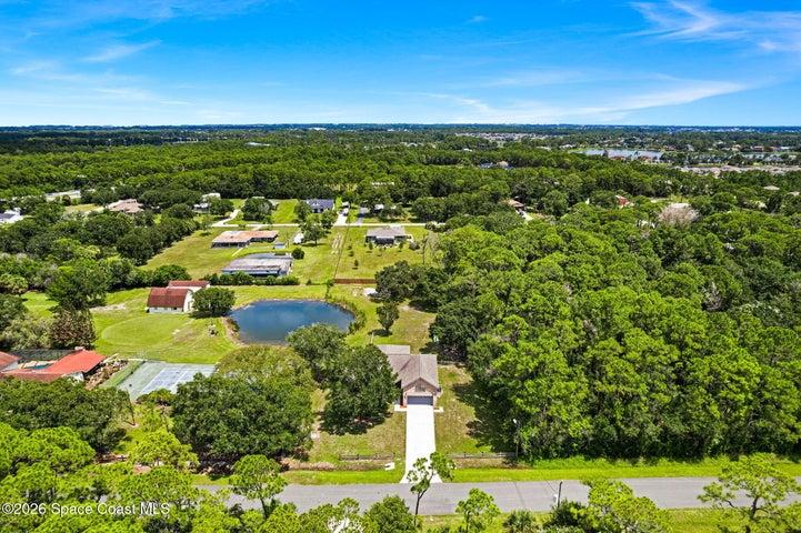 Elevated view showing the home’s proximity to natural surroundings