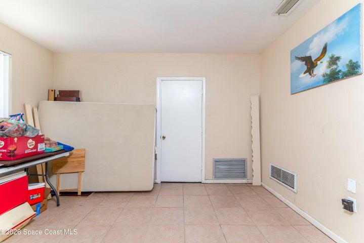 Nestled between kitchen & garage.