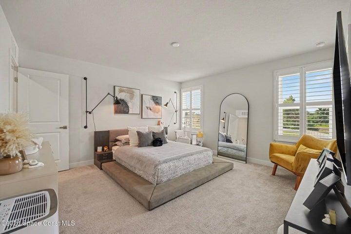 Primary bedroom with 2 walk in closets.