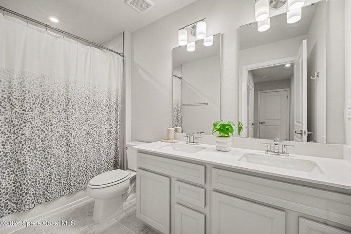 2nd bathroom with tub. Lots of cabinets.