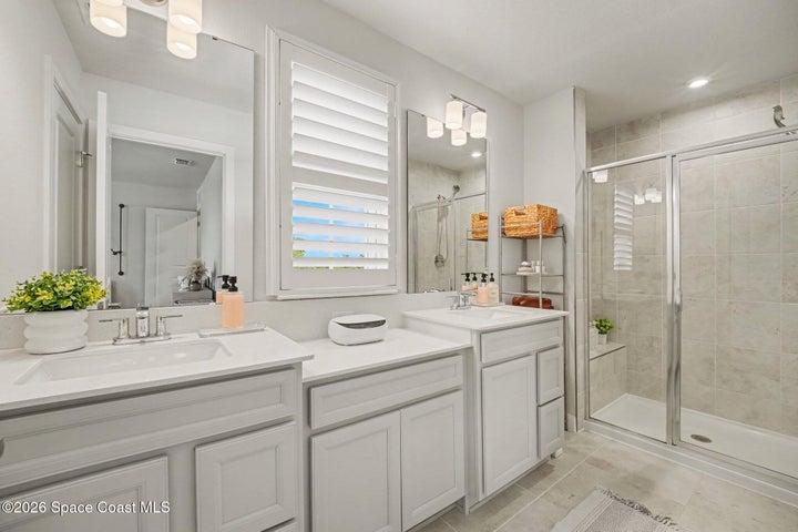 Master bath with 2 sinks & shower.