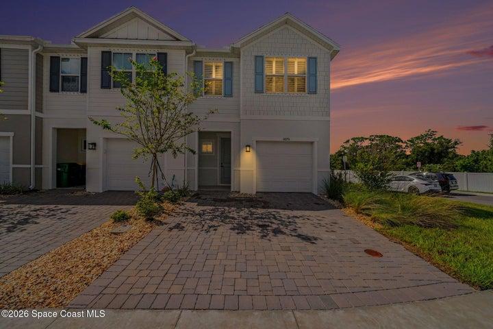 1 car garage with brick paver driveway.