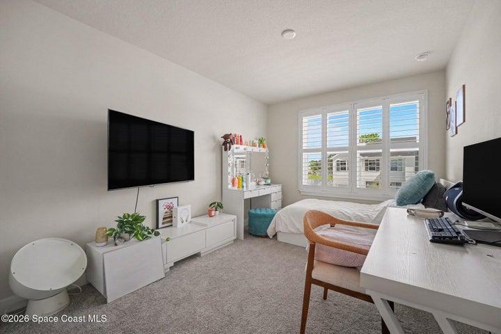 3rd bedroom with carpet & plantations shutters.
